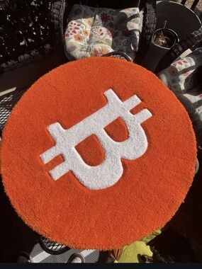 Round Orange Rug with White Bitcoin Symbol